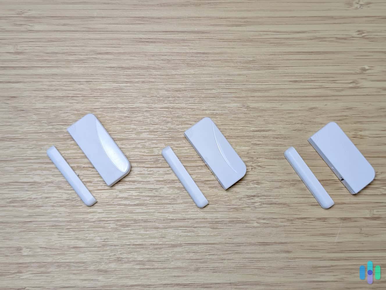 Frontpoint-door-and-window-sensors-on desk The Frontpoint Entry Sensors aren’t going to win design awards any time soon